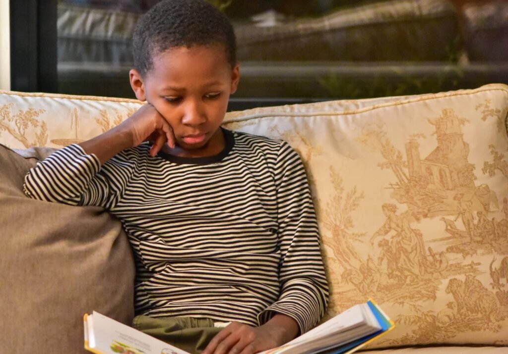 young-child-showing-early-signs-of-dyslexia-while-reading-a-book